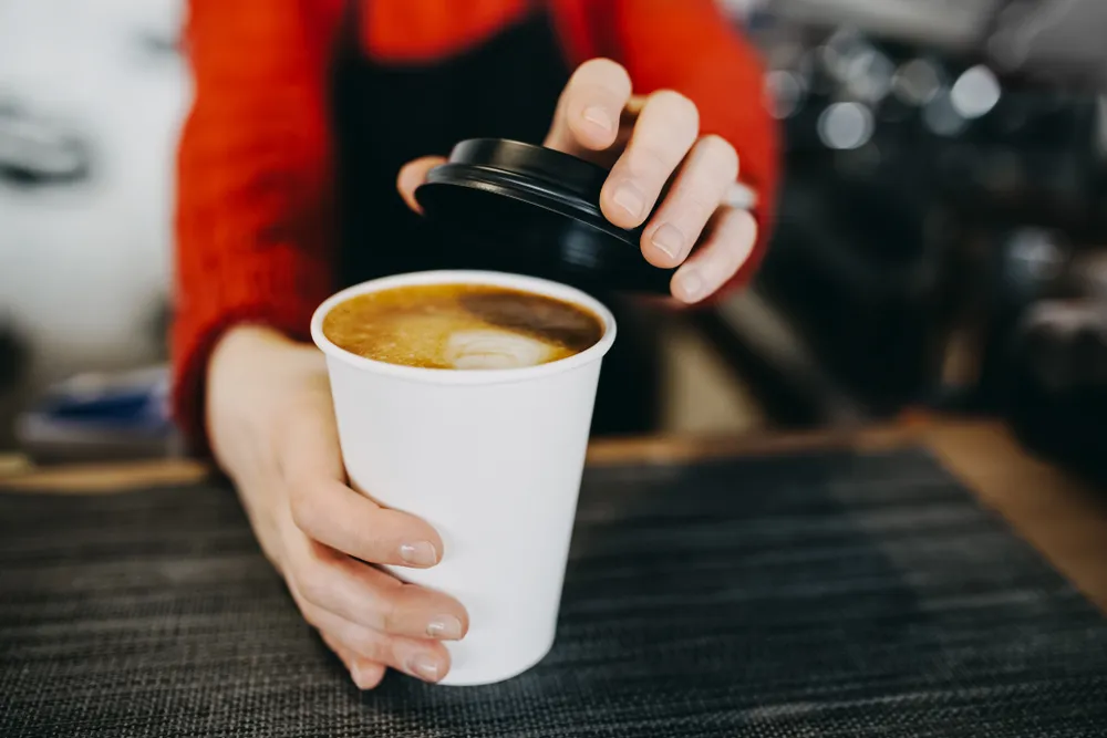 barista with a cup of coffe
