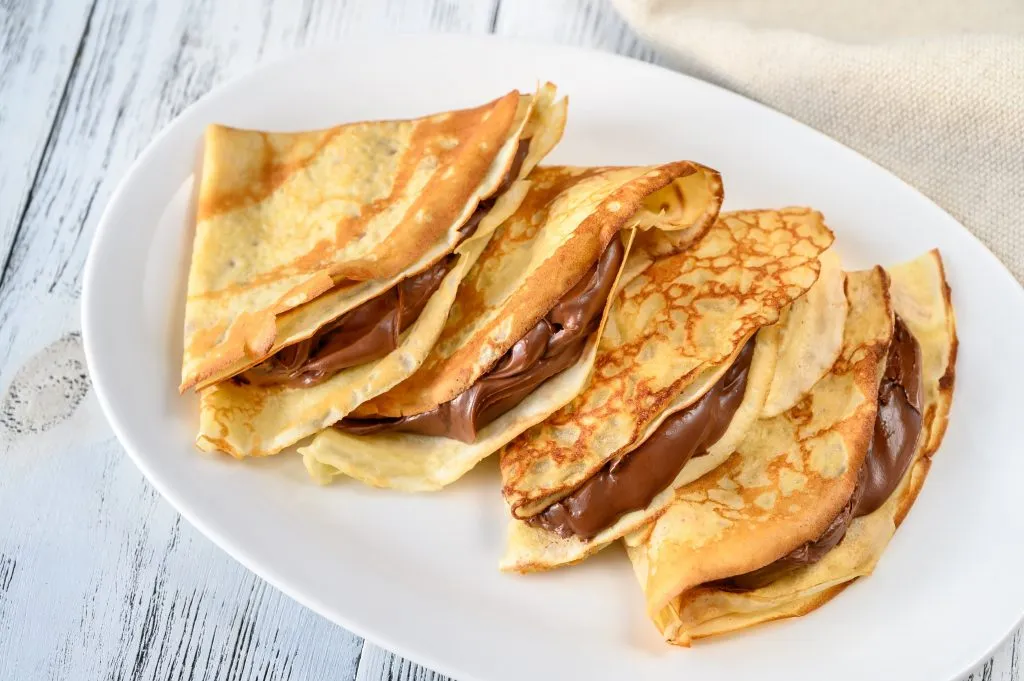 Chocolate crepes with cream