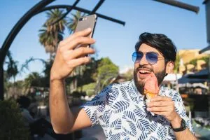 Customer enjoying ice cream from a food truck