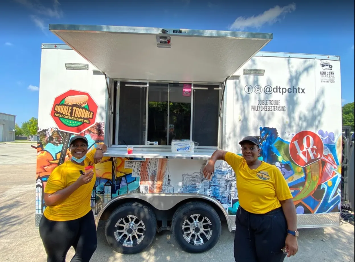 happy-clients-with-their-new-food-trailer